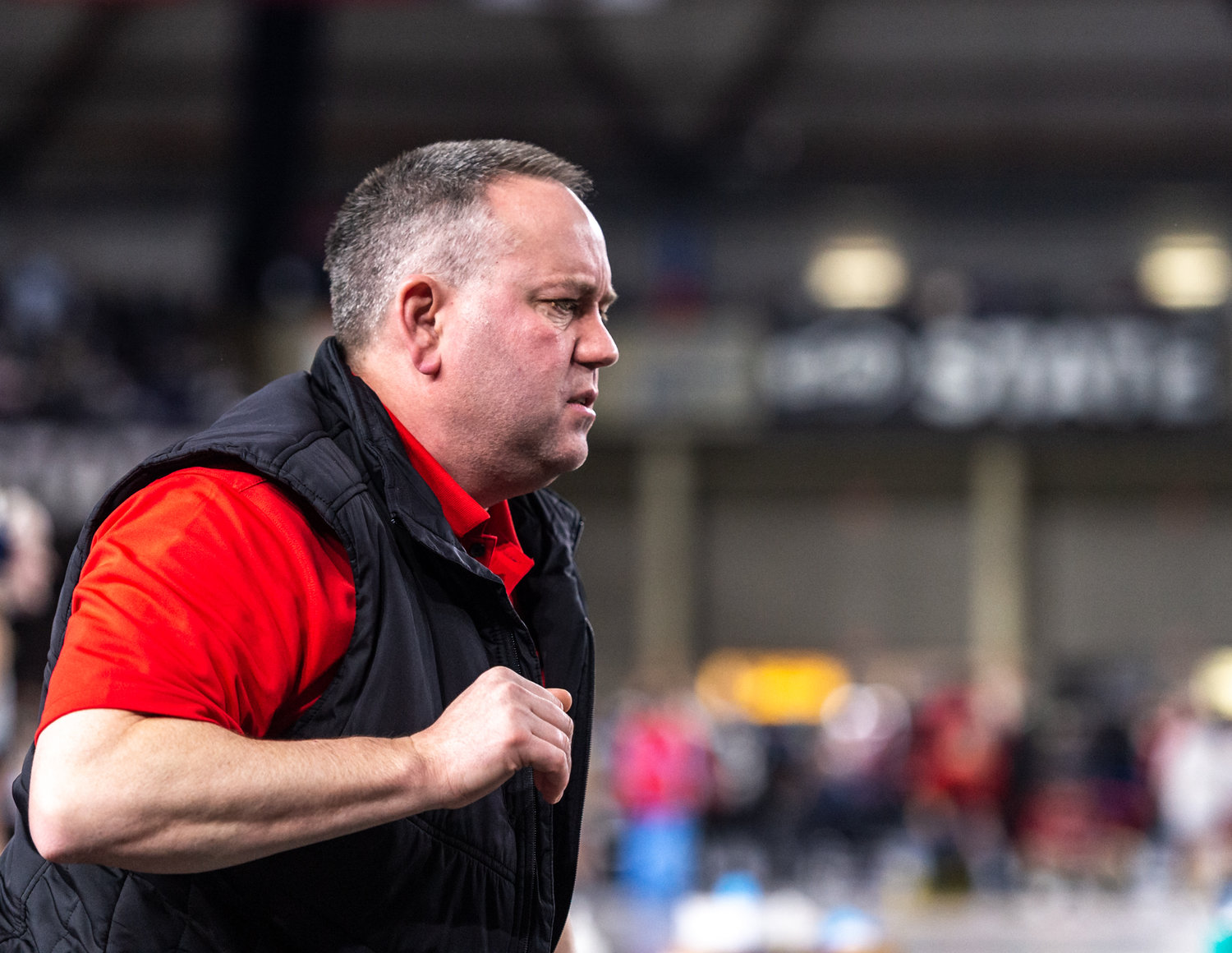 A Yelm coach watches his grappler at Mat Classic XXXIV on Friday, February 17, 2023, at the Tacoma Dome. (Joshua Hart/For The Chronicle)
